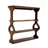 A small Arts and Crafts style wall shelf, 27x8.5x27.5cm