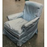 An early 20th century armchair, with feather filled cushions and loose cover, on square tapered