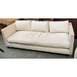 A vintage Oscar Woollens, Finchley Road, contemporary sofa upholstered in a white cord fabric, on