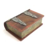 A bakelite and metal bound novelty trinket box in the form of a book, 15.5cm wide