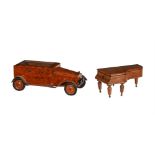 A burr wood cigarette box in the form of a motor car, early 20th century 29cm long Together with a