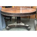 A Regency mahogany breakfast table, circular tilt top with moulded edge, on a tapering column and