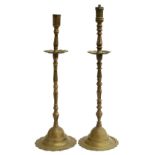 A near pair of large brass candlesticks, later part converted, 63cm and 67cm high