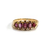 A gold and garnet five stone ring, marks rubbed, size Q 1/2, 3.5g