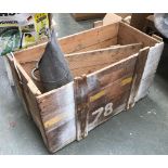 A vintage packing crate with a coal scuttle