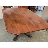 A 19th century mahogany rectangular tip-top dining table, on turned column and four swept legs