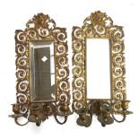 A pair of 20th century gilt metal girandole mirrors, each with three candle fittings (one plate