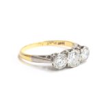 An early 20th century 18ct gold and platinum diamond trilogy ring, total diamond weight approx. 0.