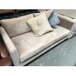 A smart contemporary two seater sofa, in an oatmeal coloured fabric, 171cmW 92cmD