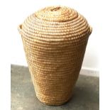 A wicker laundry basket, 68cmH