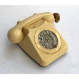 A cream rotary dial vintage telephone