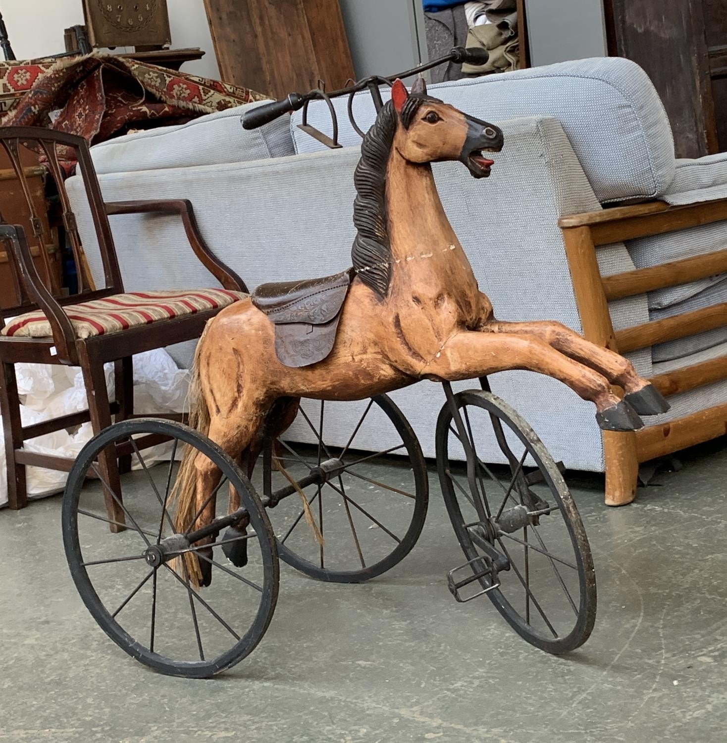 A vintage hobby horse tricycle with leather saddle, 88cmH
