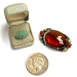A USA 1924 silver peace dollar; together with a large Miracle costume brooch set with citrine glass,