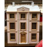 A pink painted dolls house, 61cmW