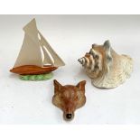 A Shorter & Son figurine of a boat, 24cmH; together with a mid century fox mask wall plaque and a