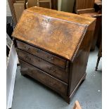 A George III walnut bureau, fall front opening to a fitted interior with pigeonholes and drawers,