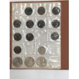 An album containing a quantity of coins to include pre 1947 silver, 1/2 pice India 1905, Victorian