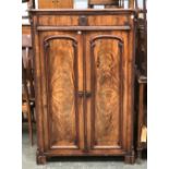 A Victorian mahogany serpentine cupboard, blind drawer, over panelled doors, 92x40x132cm