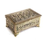 A heavy brass box decorated with a double headed eagle surrounded by grapes and vines, hinged lid,