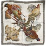 An Hermes silk scarf designed by Henri de Linares, pheasants on a white ground within a grey border,