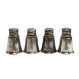 A set of four silver conical peppers and salts, screw tops, all marked 'International Sterling S46',