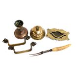 An antique brass service bell, 11.5cmD; copper candlestick holder, 12.5cmH; brass handles and a bone