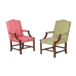 A pair of Gainsborough armchairs in George III style, one upholstered in pink, the other in green,