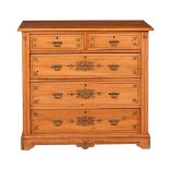 A late Victorian satin walnut and painted chest of drawers, with two short and three long drawers,
