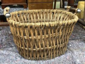 A wicker basket with metal handles