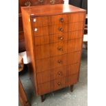 A mid century Meredew teak chest of seven drawers, 61x45x119cmH