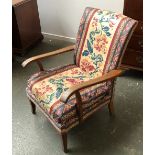 A Parker Knoll model 717 oak open armchair, 62cmW