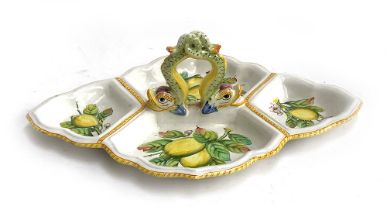 An Italian Majolica Cantagalli Firenze hors d'oeuvre dish, twin dolphin handle, painted with lemons,