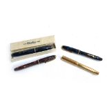 Three Conway Stewart 'Dinkie 550' fountain pens with 14ct nibs, one boxed, together with a further