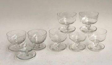 A set of five hand blown trifle dishes; together with three others with engraved decoration