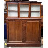 A late George III mahogany and glazed side cabinet, the top section with three glazed doors and