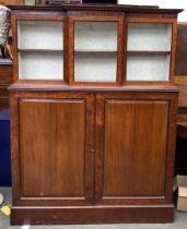 A late George III mahogany and glazed side cabinet, the top section with three glazed doors and