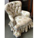 A 20th century floral button upholstered bedroom chair