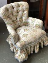 A 20th century floral button upholstered bedroom chair