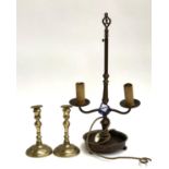 A two fitting table lamp, together with a air of brass candlesticks, each 19cmH