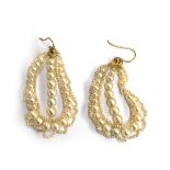 A pair of delicate pearl earrings, designed as a central string of seven pearls framed within a