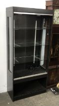 A black stained display cabinet, 76cmW