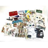 A mixed lot to include postcards, stamps, UK coin collection 1982, train tickets, matchbox covers,