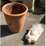 A large terracotta plant pot, 44cmD, 46cmL, together with a mask wall planter