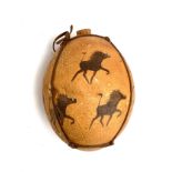 A vintage Bushman Tribal Art Ostrich Egg water flask painted with hunting scenes, leather strapwork,