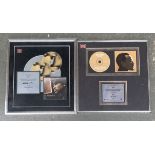 Two framed presentation CDs commemorating 600,000 copies sold of Usher's 2004 "Confessions" and 300,