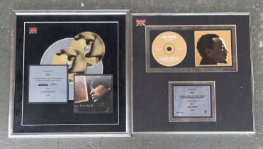 Two framed presentation CDs commemorating 600,000 copies sold of Usher's 2004 "Confessions" and 300,