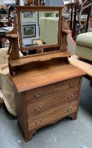 An early 20th century chest of three drawers, with superstructure and adjustable mirror above,