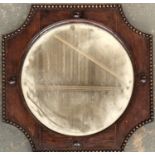 An oak framed mirror with circular bevelled plate and bead moulded frame, 45x45cm