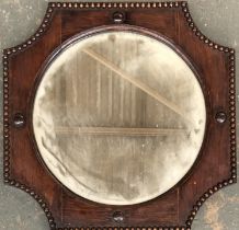 An oak framed mirror with circular bevelled plate and bead moulded frame, 45x45cm