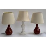 A pair of red glazed ceramic table lamps, approx. 36cmH to top of light fitting; together with a